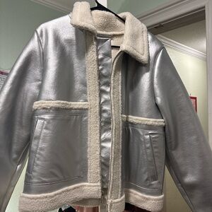 Metallic silver faux leather jacket with cream faux shearling trim.